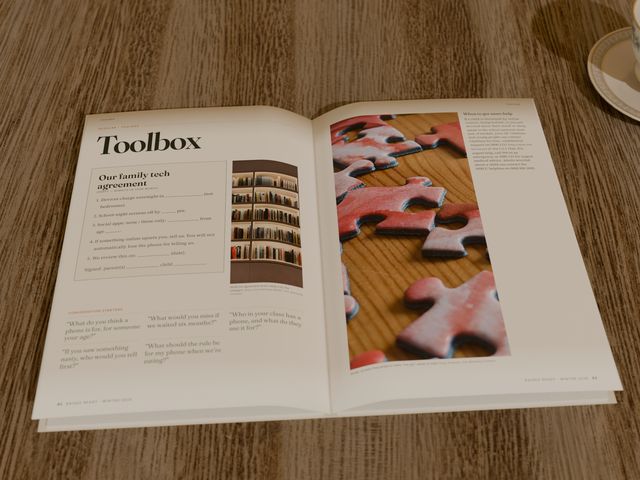 The magazine open at a practical feature called When should they get a phone?